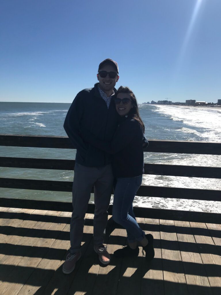 Mom and dad in Florida in front of an ocean