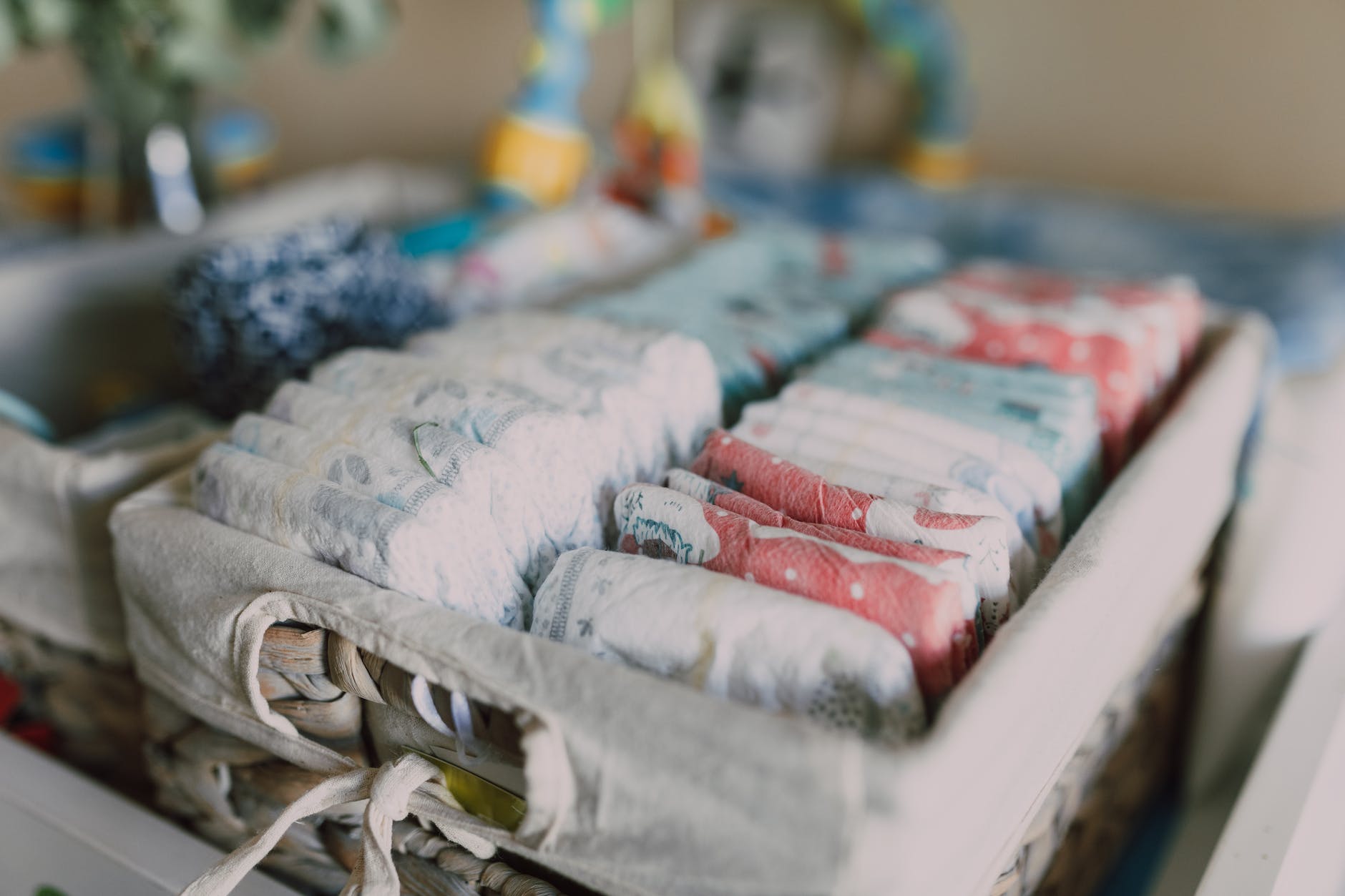 organized diapers on woven basket