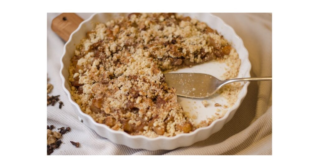 Apple cake with a crumble on top. Spices on left corner.