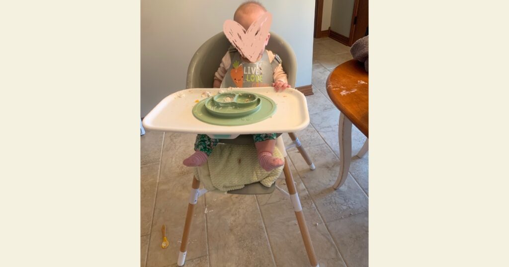 Baby in skip hop 3-in-1 high chair 