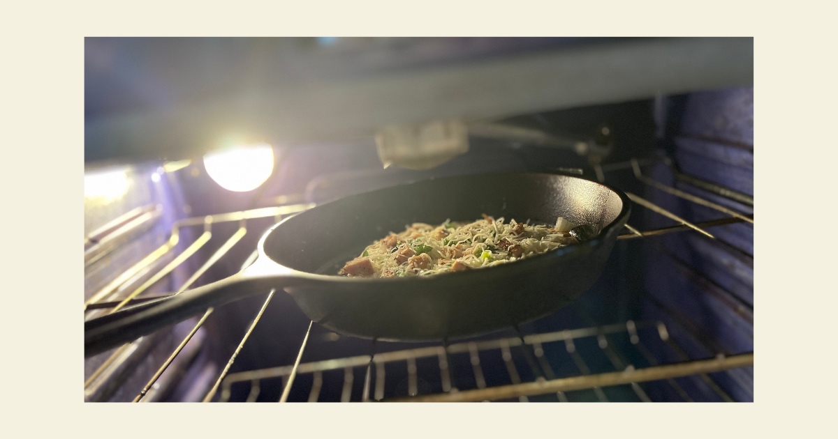 Sourdough BBQ pizza in a cast iron skillet within the oven.