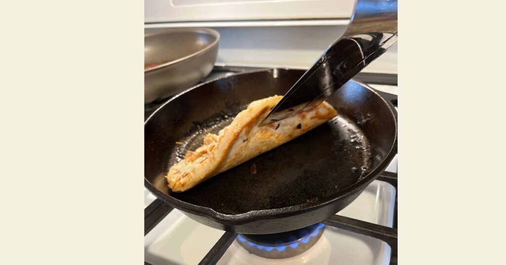 Sourdough pizza crust pulling from cast iron skillet