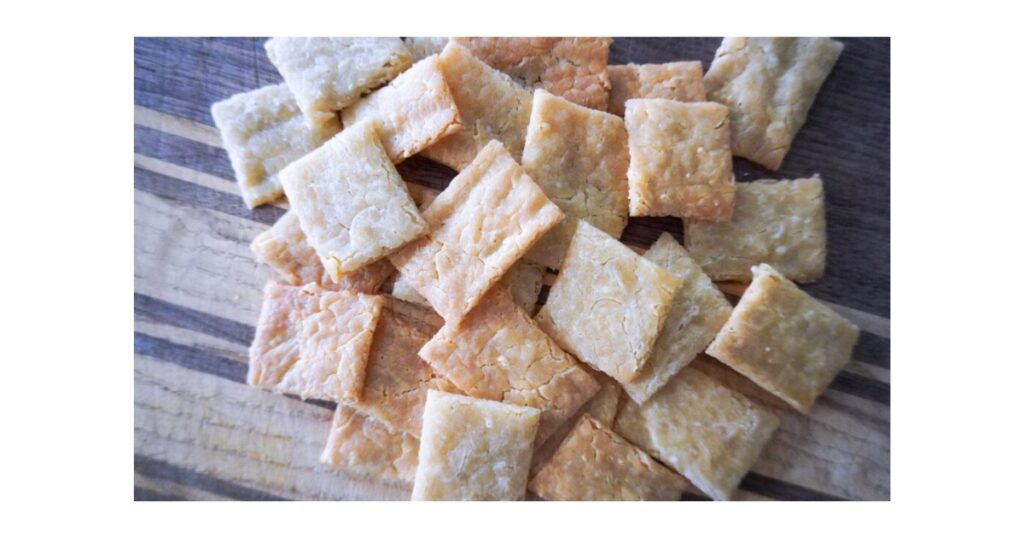 sourdough cheez-its stacked on a plate