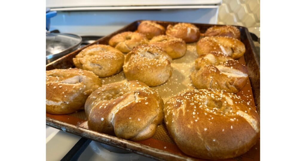 sourdough pretzel bagels on a pan