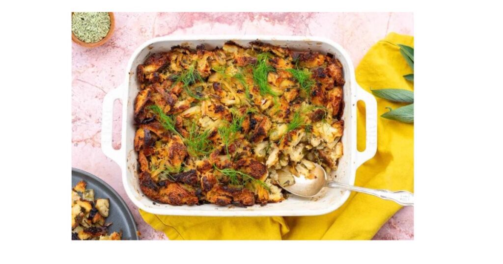 stuffing with fennel in a white baking dish