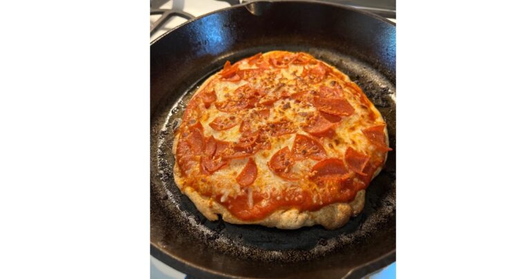 sourdough pizza in cast iron skillet