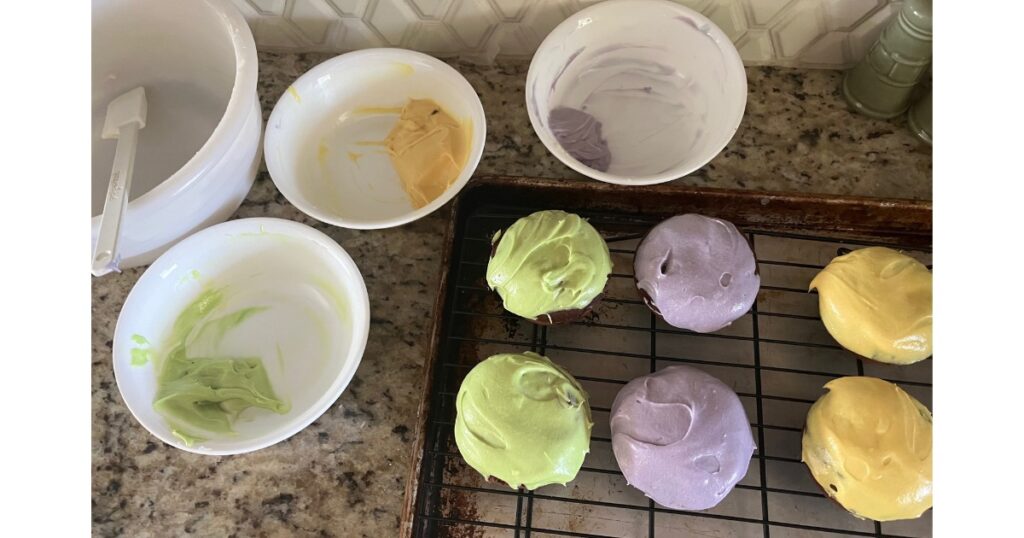 frosting donuts with green, purple and orange colors