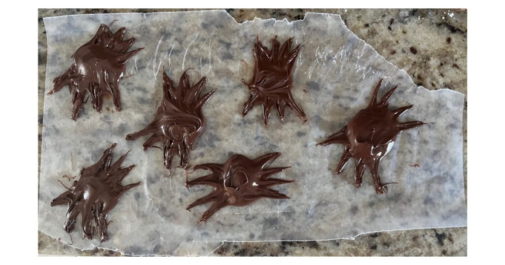 homemade chocolate spiders on wax paper