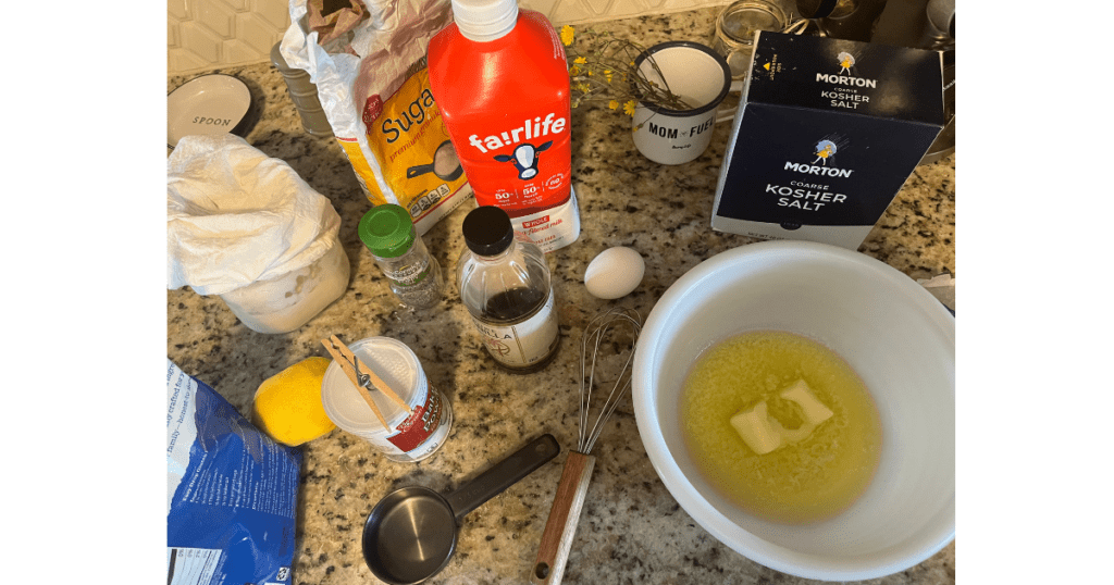 ingredients for donuts on a marble countertop