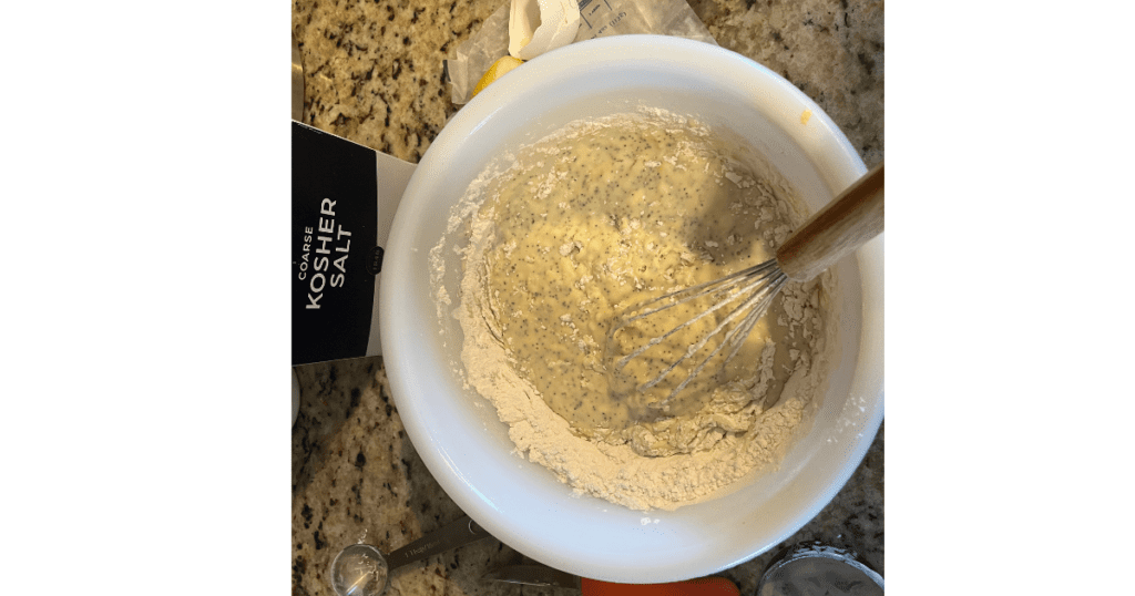 donut mixture with whisk in white bowl