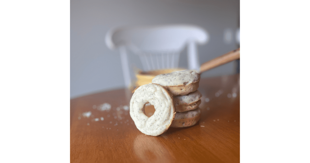 stack of 3 lemon poppy seed donuts on a table