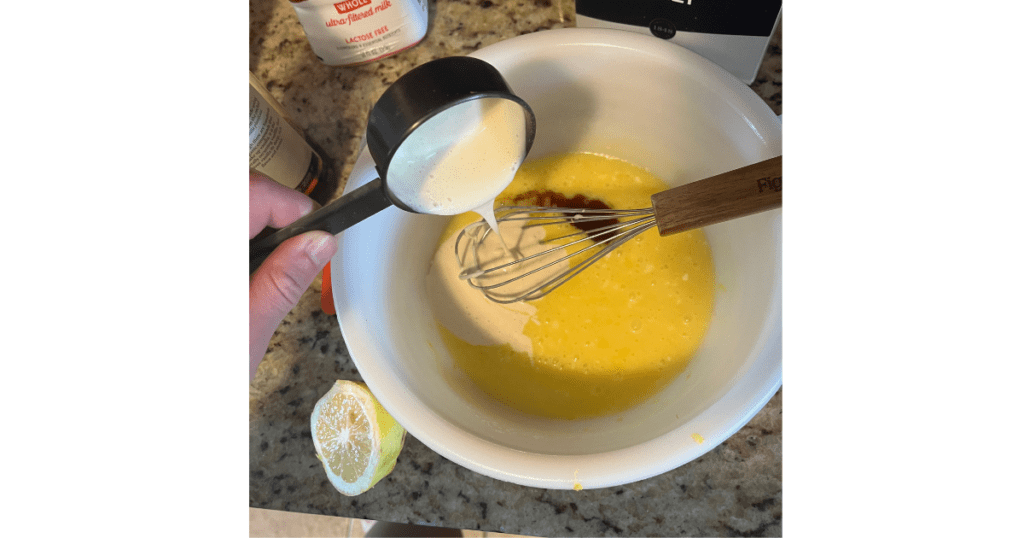 sourdough discard being poured into a mixing bowl of wet ingredients.