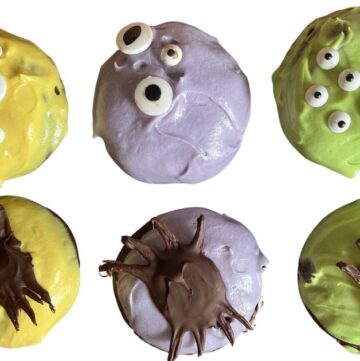 decorated monster donuts with edible eyes and chocolate spiders