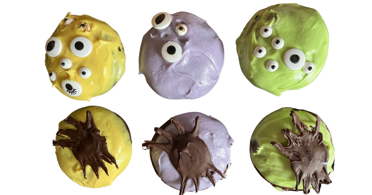 decorated monster donuts with edible eyes and chocolate spiders