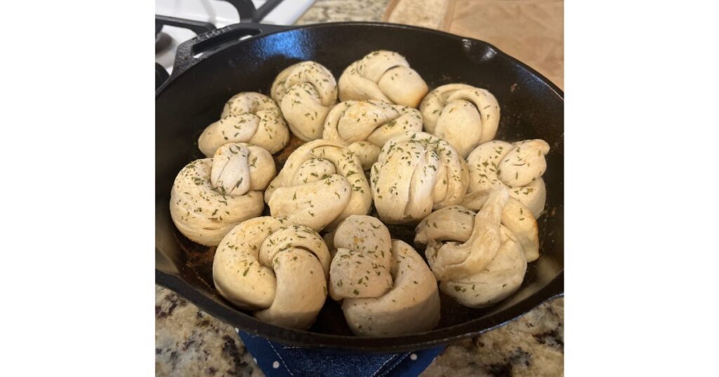 garlic knots in cast iron skillet