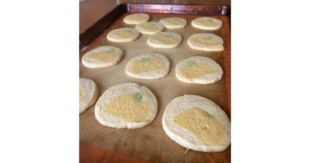 pumpkin cookies on a baking sheet