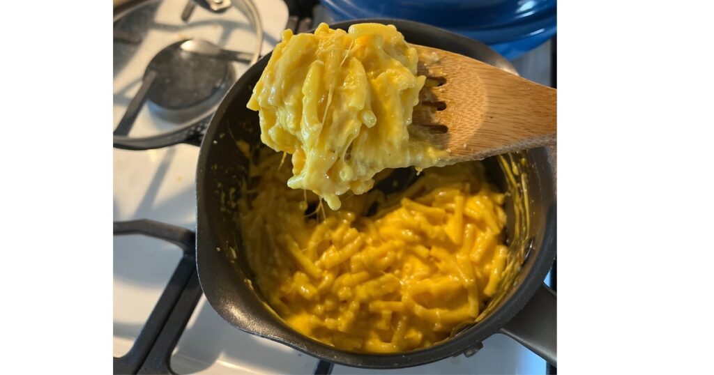 mac and cheese on wooden spoon