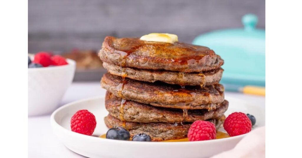 pancakes stacked with raspberries and blueberries