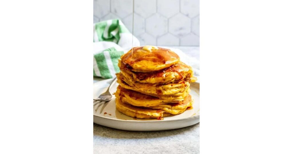 pumpkin pancake stack with maple syrup