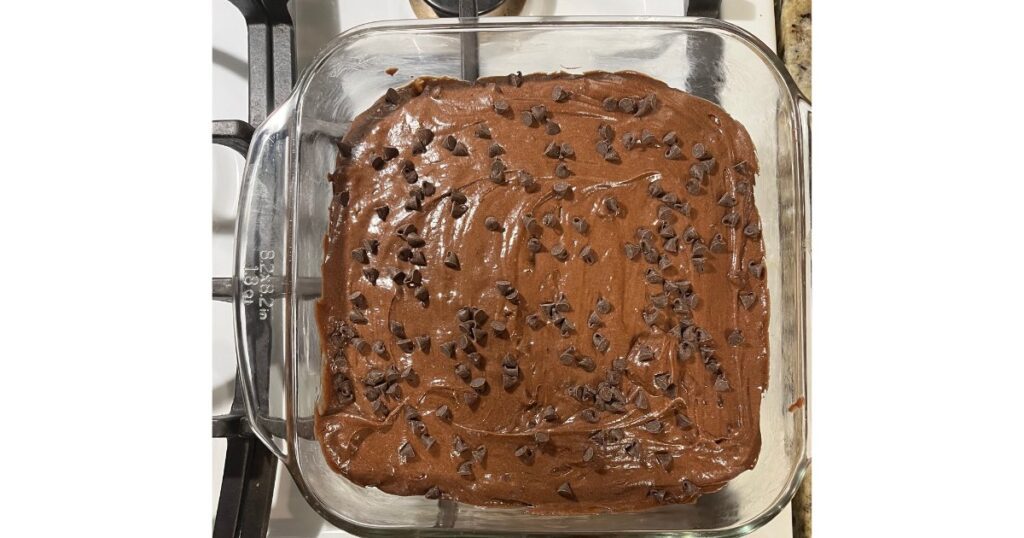 sourdough brownies with chocolate chips in glass pan