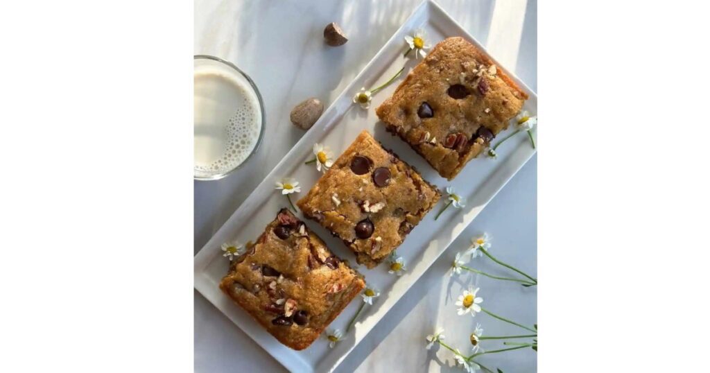 Three blondie bars on a tray