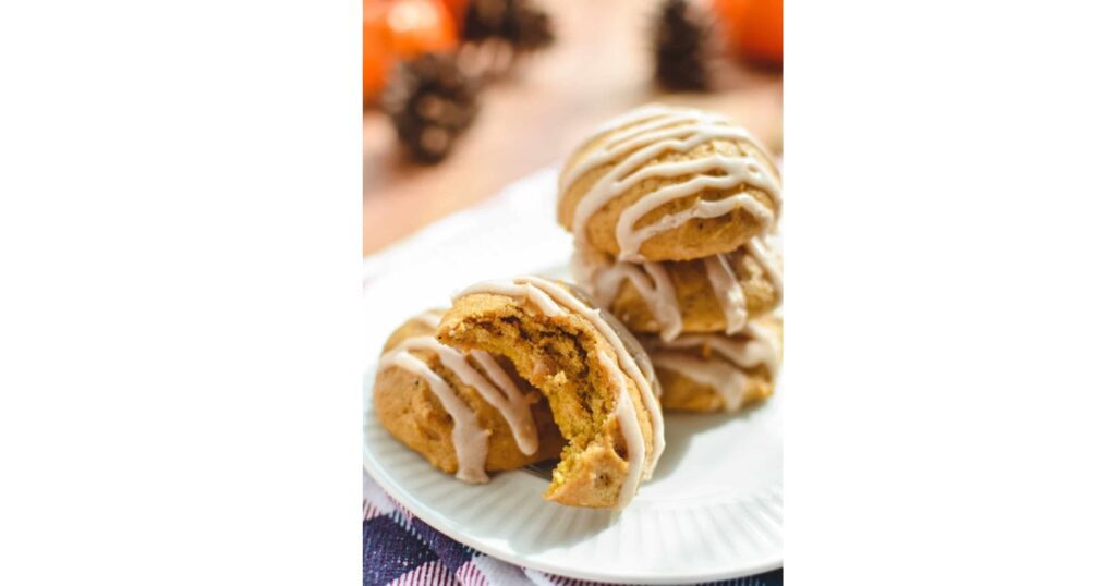 stack of pumpkin muffins with glaze on top