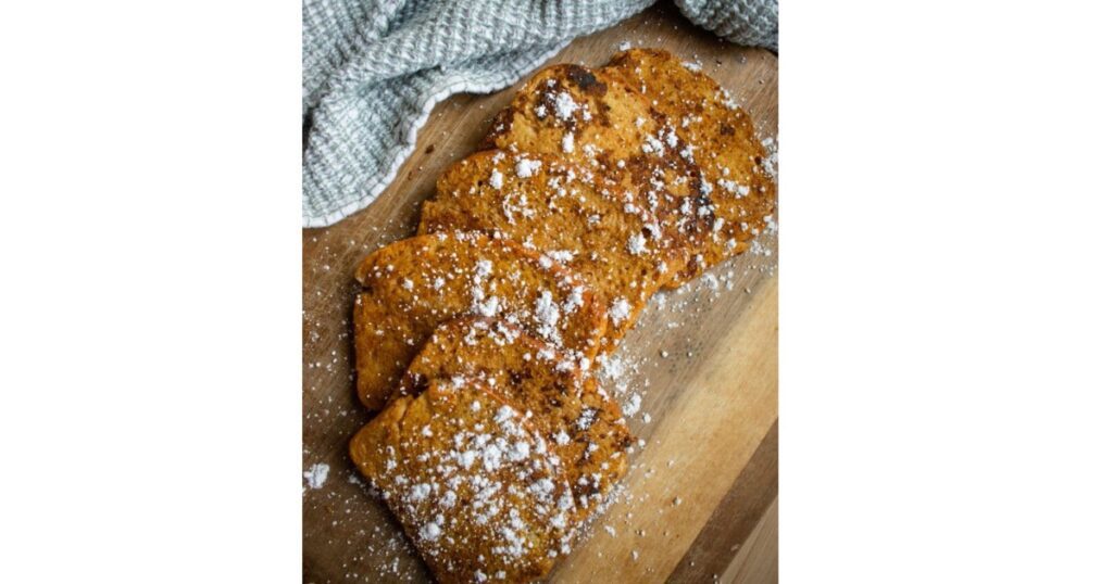 stack of french toast with powdered sugar on top