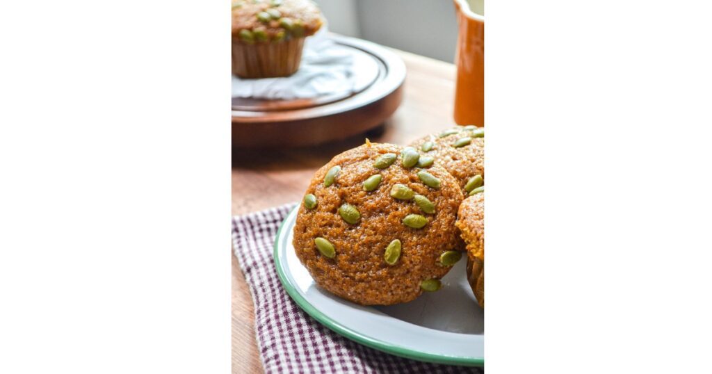 pumpkin muffins with pumpkin seeds on top