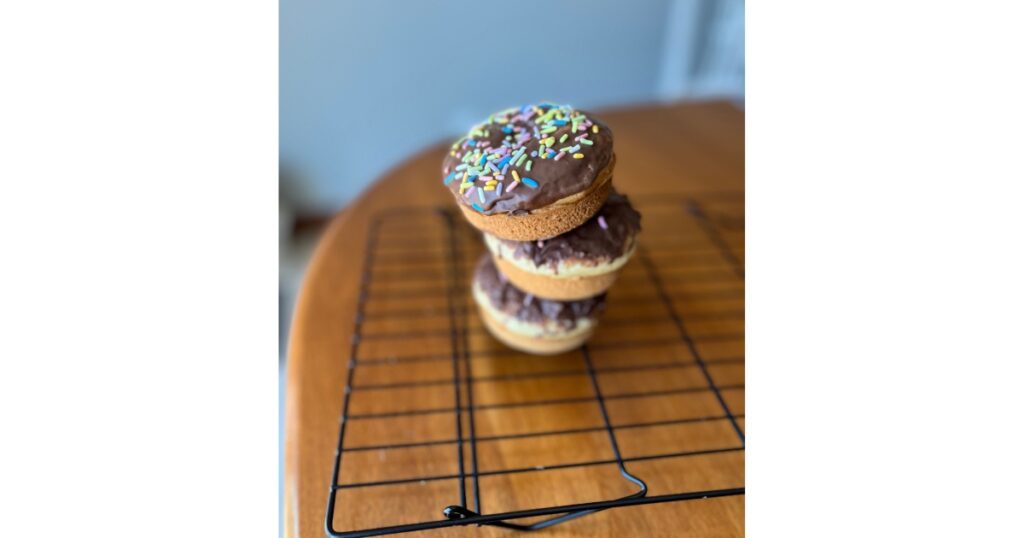 stack of three donuts tipping over