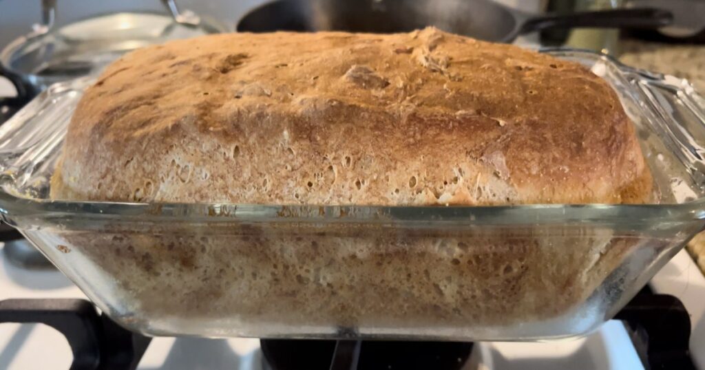 cooked sourdough english muffin bread in pan