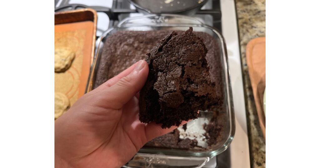 sourdough brownies slice in hand