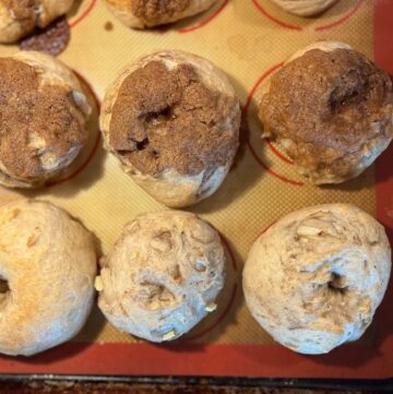 apple cinnamon sourdough bagels on sheet tray