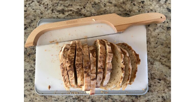 sourdough bread behind a loaf of sourdough english muffin bread