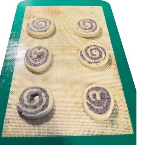 six pinwheel cookies on silicone sheet