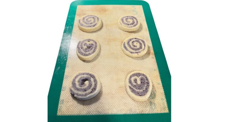 six pinwheel cookies on silicone sheet