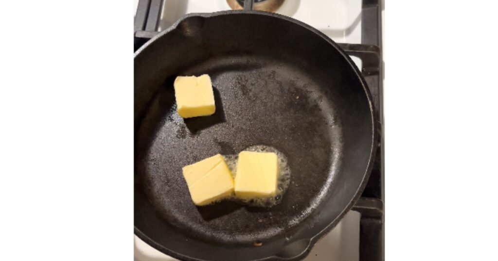 butter melting in cast iron skillet