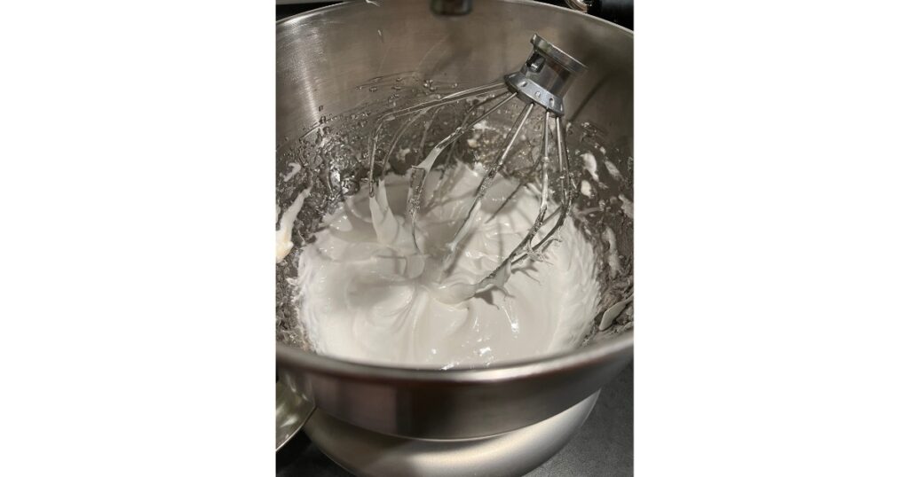 marshmallow fluff in mixing bowl with wire whisk