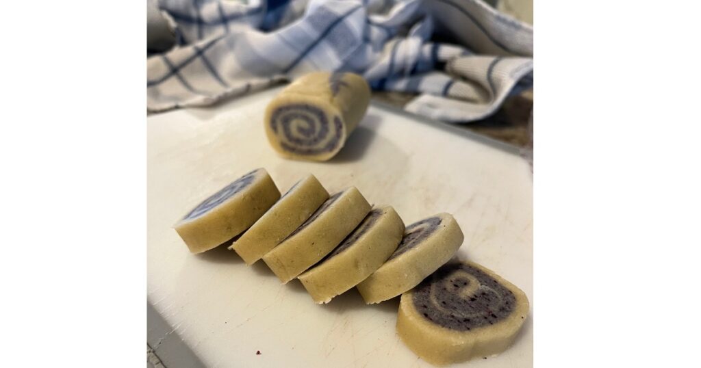 slice of blue and white pinwheel cookies