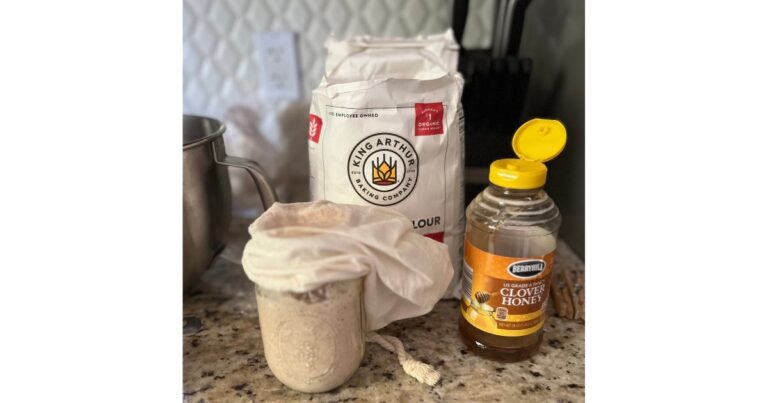 honey flour and sourdough starter on countertop