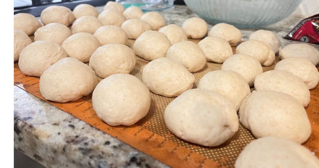 sourdough hawaiian roll dough on parchment