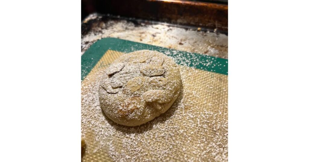 sourdough croissant cookie with powdered sugar